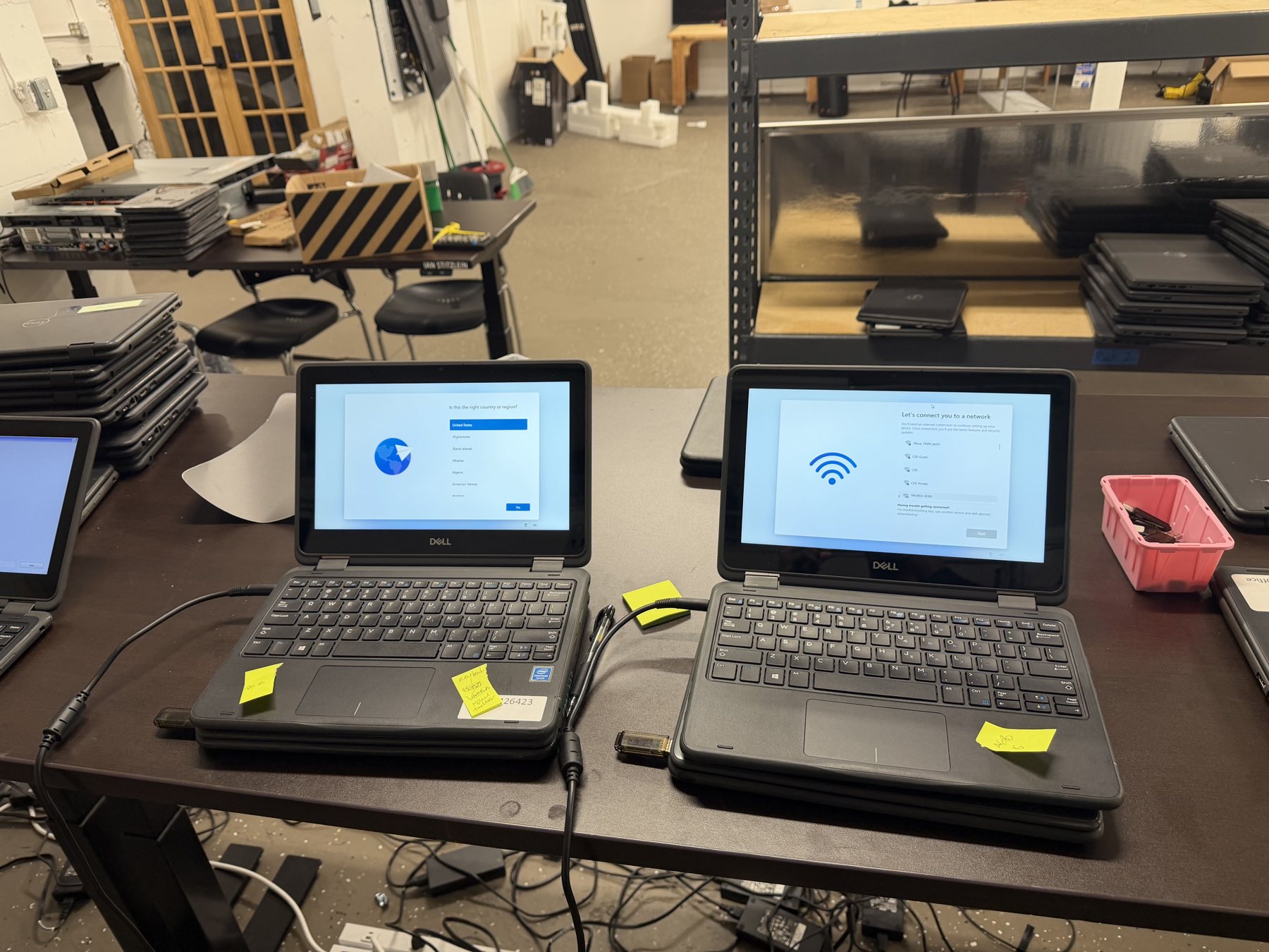 Open laptops displaying setup screens on the GRT workbench
